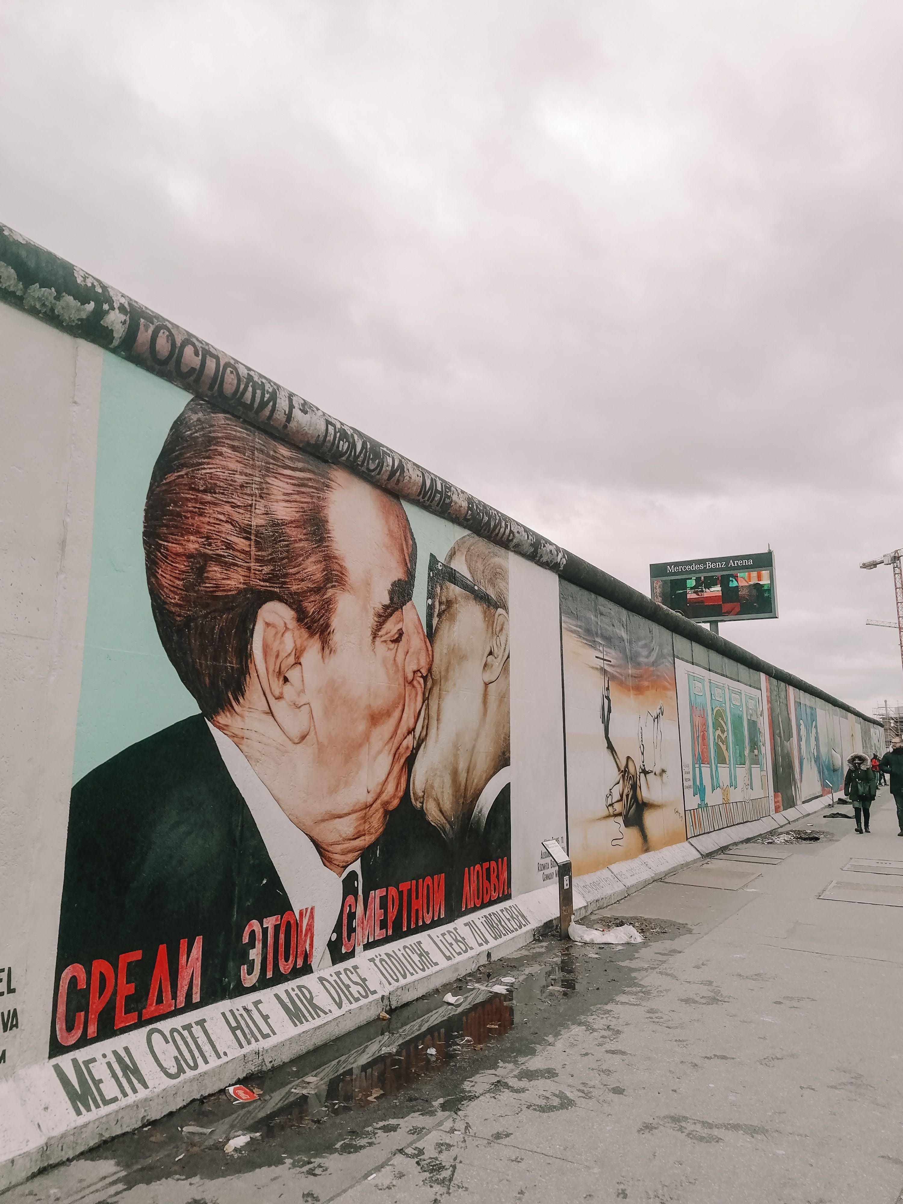 The Berlin East Side Gallery: Brotherly Kiss, Trabant Through the Wall, and the Night the Wall Opened