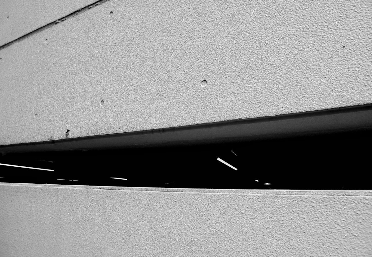 black metal bar on white wall
