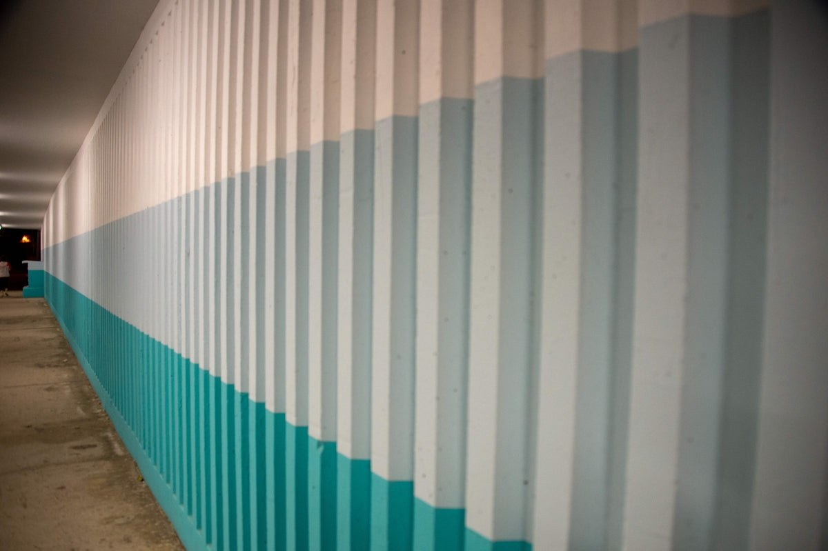 a wall with a blue and white striped wall