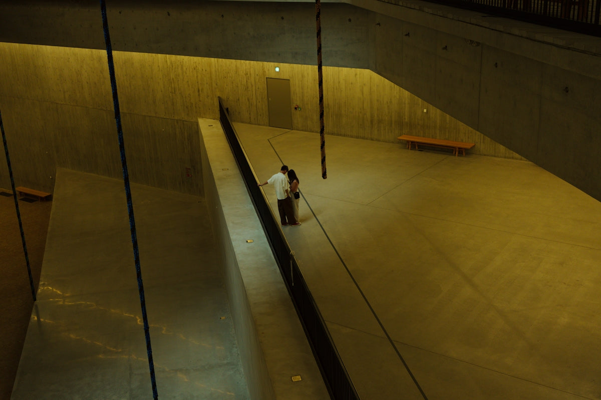 a person standing on a ramp in a building