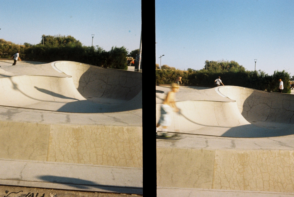 A man riding a skateboard up the side of a ramp