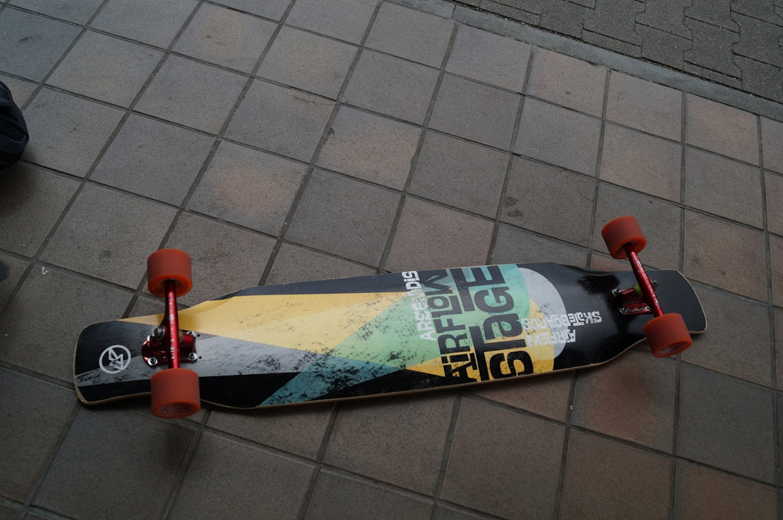 A skateboard that is laying on the ground
