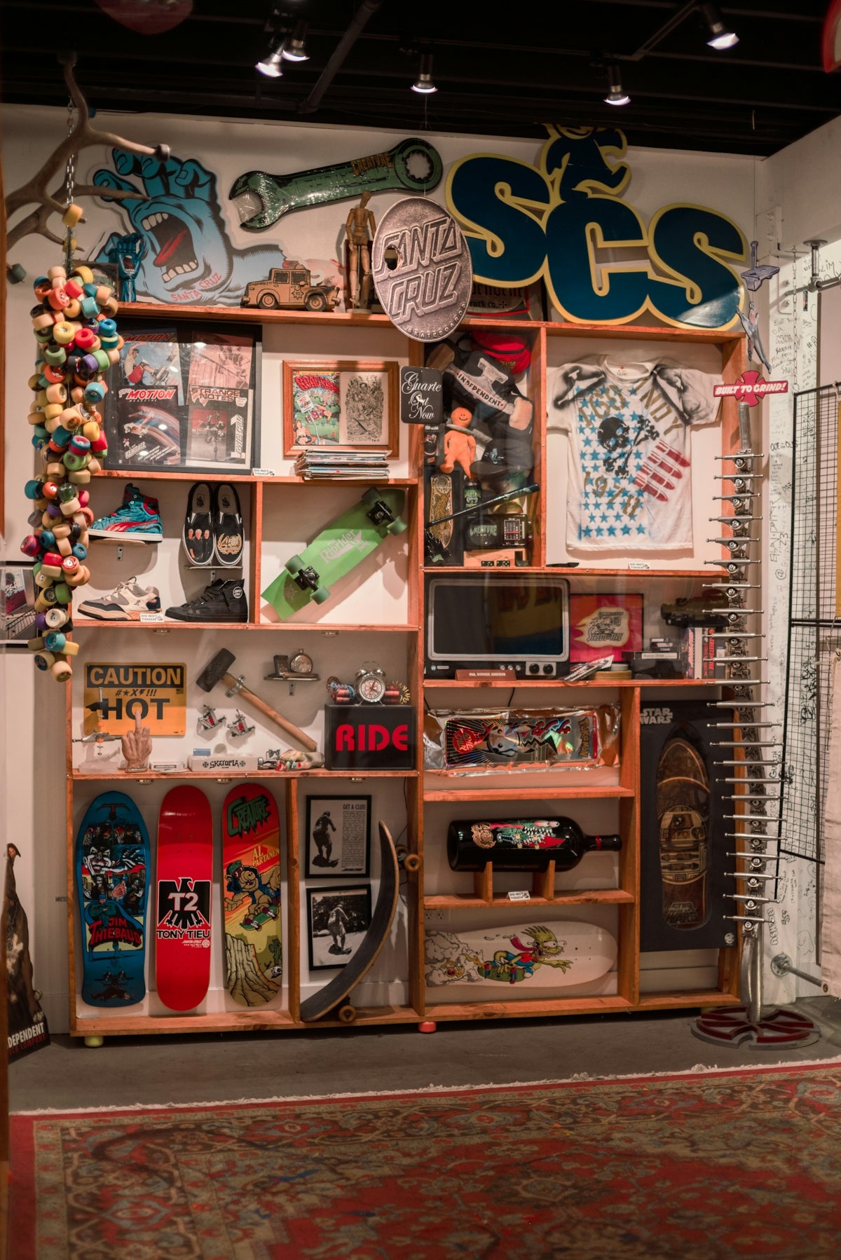 Skateboards and memorabilia displayed on shelves